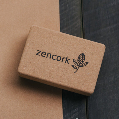 Brown cork block with 'zencork' branding on a wooden surface