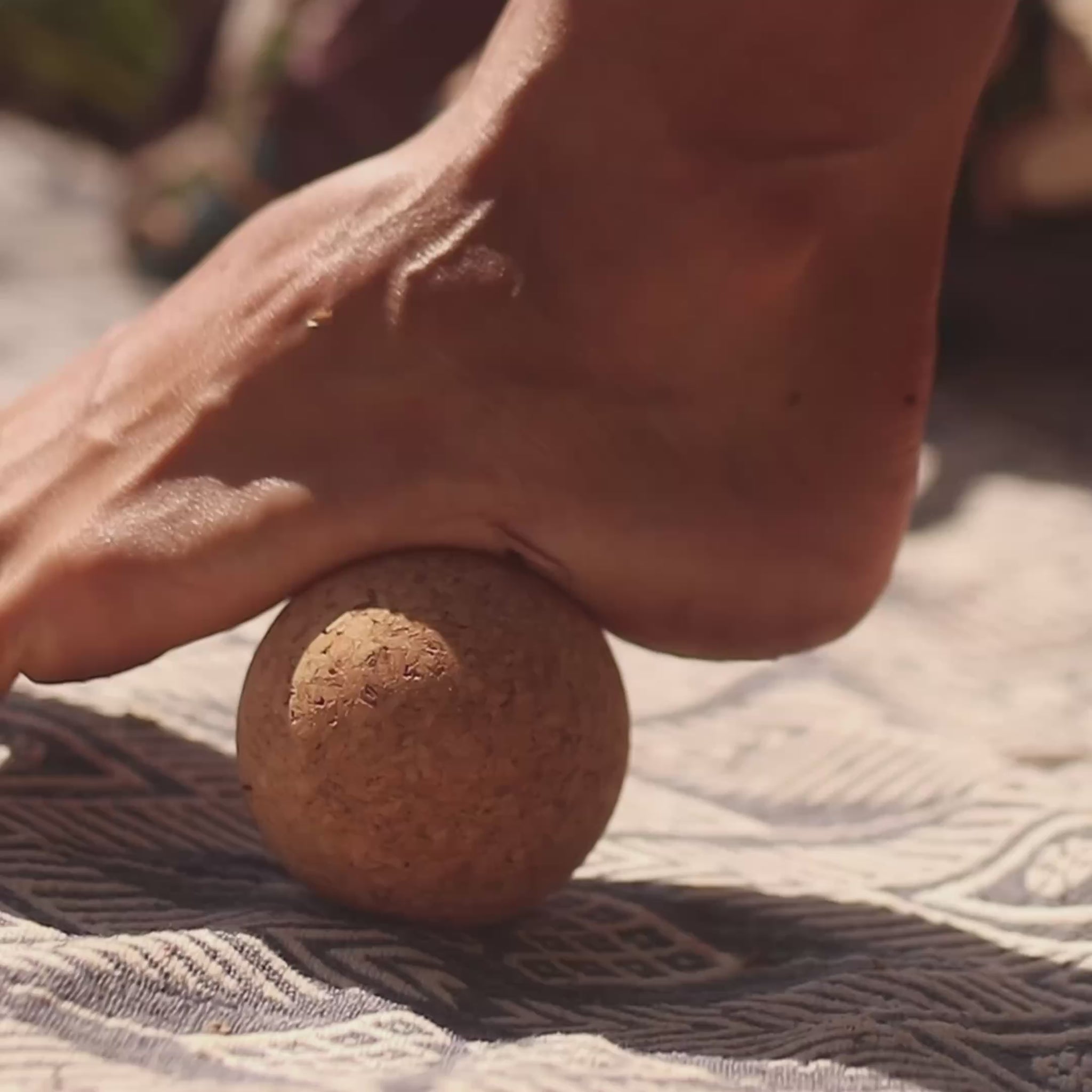 rolling foot out on single cork massage ball